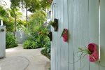 A gated compound, walk down the tropical, orchid laden path to the private entrance